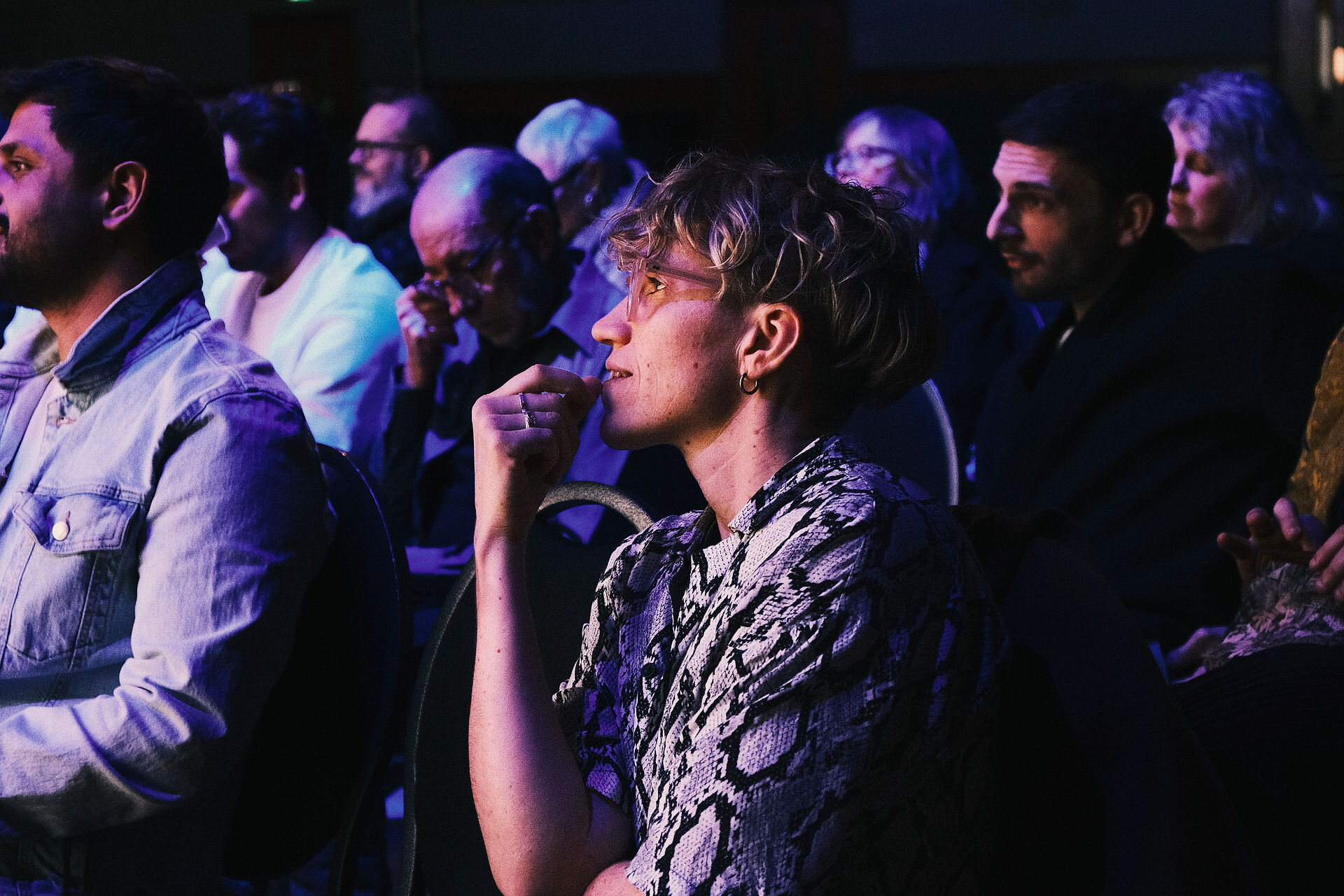 Audience members listening intently at a past Play Office artist development conference.